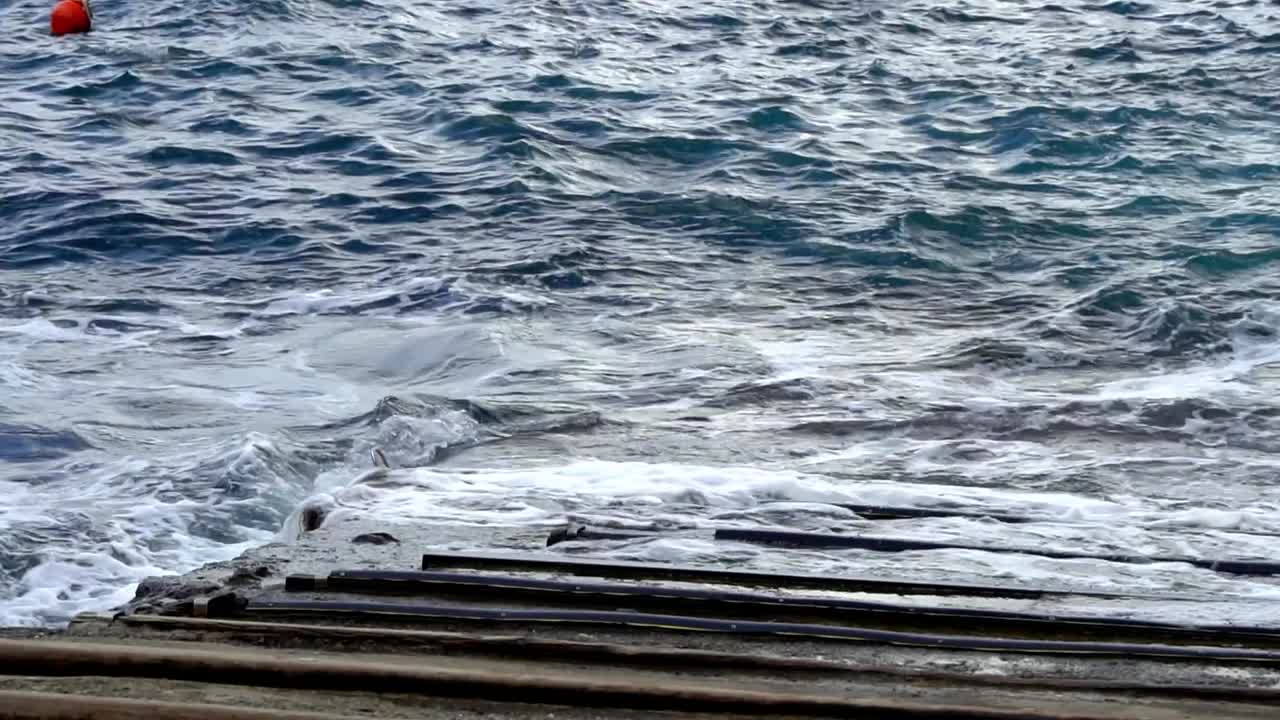 Waves Crashing On The Rocky Coastline In The Cinque Terre Region Of Italy. Slow Motion Shot