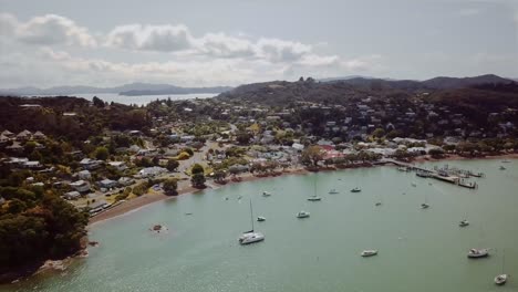 aerial tracking around the township of russel as boats are anchored on a summers day