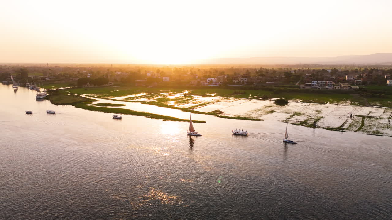Drone view of felucca cruising near riverbank in Luxor