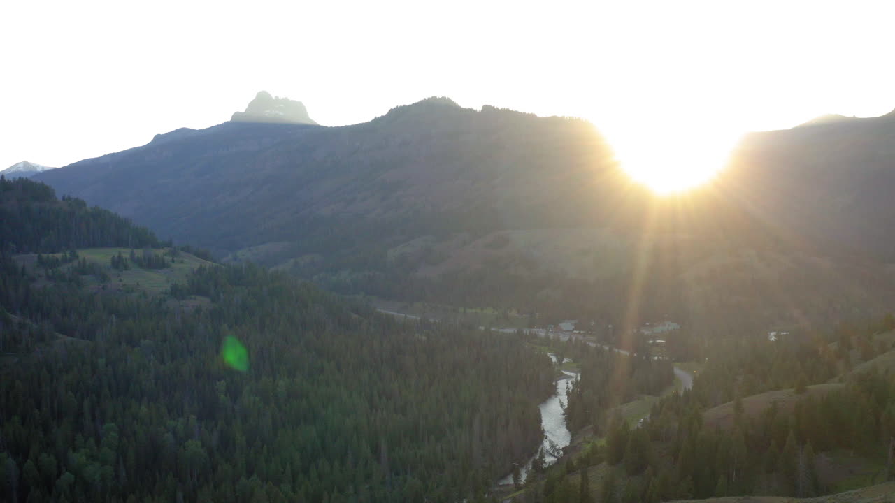 Scenic Mountain Valley Landscape with River and Forest at Sunrise or Sunset