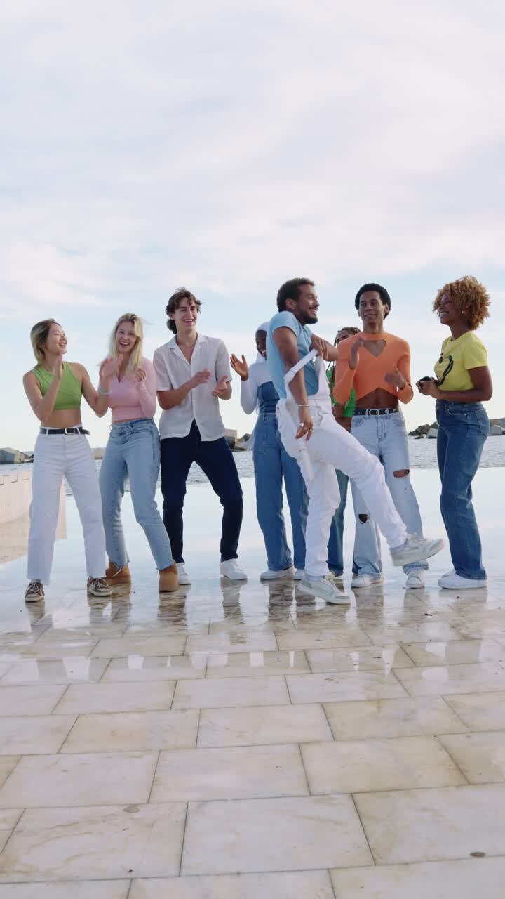 Group of diverse young people dancing and celebrating