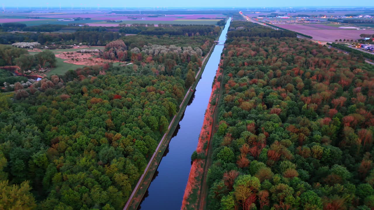 Peaceful canal in Dutch nature. A calm canal winds through lush greenery, mirroring nature's colors in the scenic Netherlands