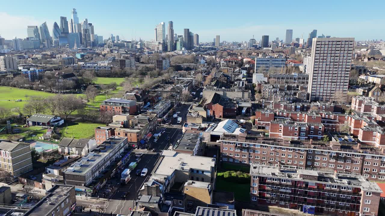 Bethnal Green road London contrasting with city skyline drone,aerial
