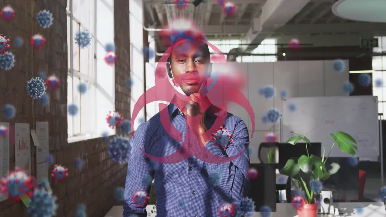 Man raising hand and lowering mask, revealing smile with biohazard virus overlay obscuring scene