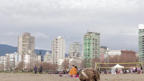 Various-drone-shots-at-English-Bay-near-downtown-Vancouver,-BC-during-Polar-Bear-2019-event