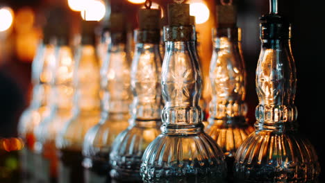 empty bottles with patterned glass are used when spilling alcoholic beverages