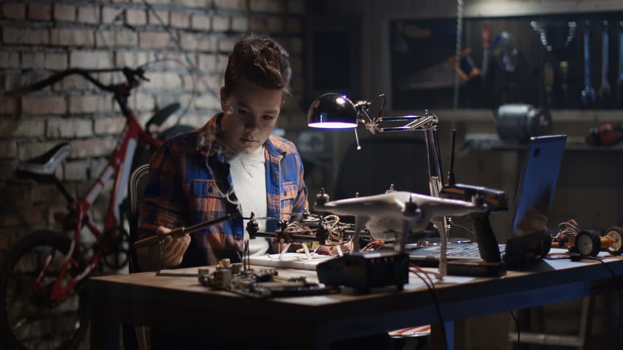 Teenage Boy Repairing a Drone