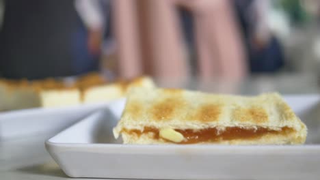 Kaya-toast-with-a-cup-of-tea-on-table-,