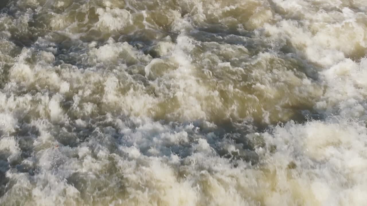 Powerful waterfall cascading with white foam and rushing waters in Owen Sound, Canada