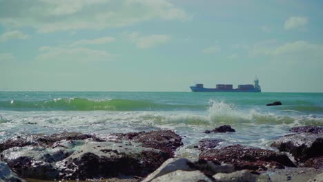 Nature-Sea-Ocean-Shore-Stones-Rocks-Waves-Waves-Crash-Sunny-Daylight-Portugal-Boat-Ship-Tanker-Oil-Tanker-Steady-Shot-4K