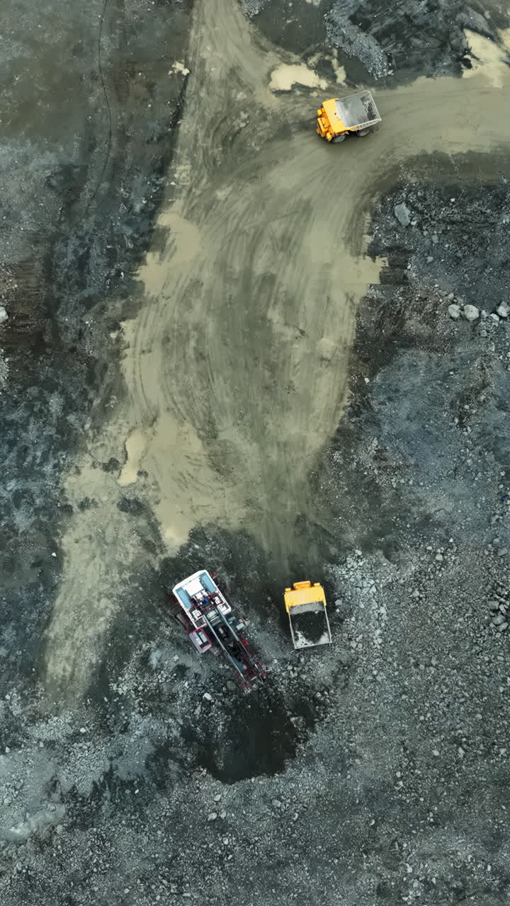 Aerial view of heavy machinery at a mining or construction site