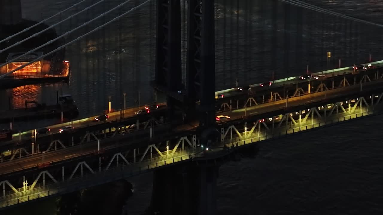 Stunning aerial view of Manhattan Bridge at night in New York City