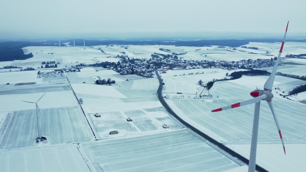 Snowy Winter Landscape with Wind Turbines