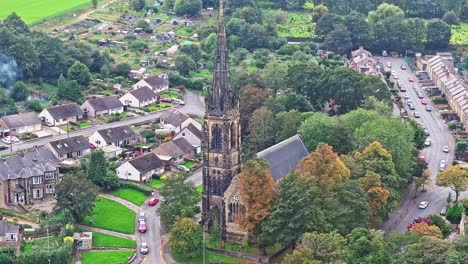 the spire of the church rises above the land in huddersfield