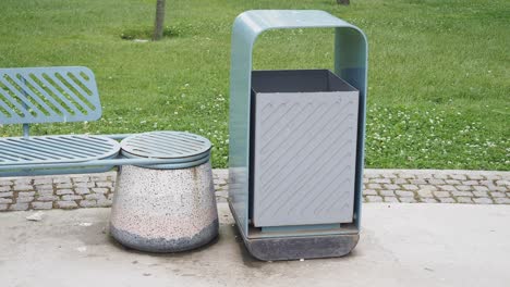 Park Bench and Trash Can in a City Park