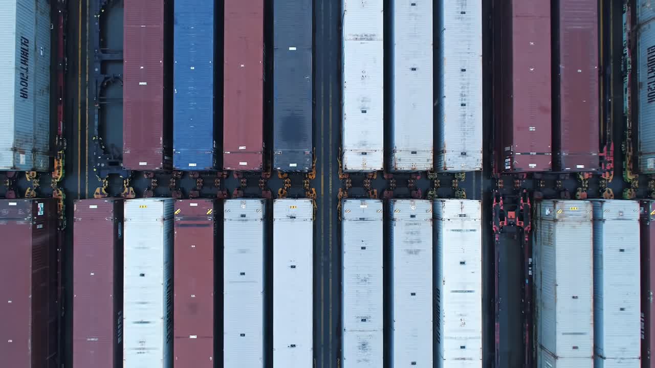 An Aerial View of a Cargo Yard Featuring Rows of Shipping Containers in Various Colors and Textures, Highlighting the Intricacies of Freight Transportation and Logistics
