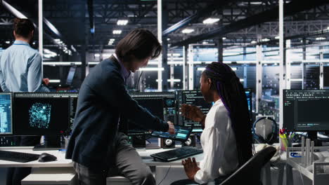 senior engineer and trainee in data center working on neural networks