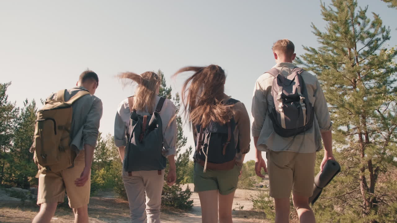 Young Friends Hiking along Trail
