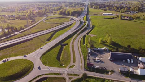 Aerial view of roundabouts handling traffic near Katlakalns in springtime