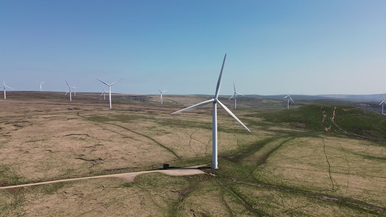 Aerial view of wind turbines farm to produce clean renewable sustainable energy target netzero