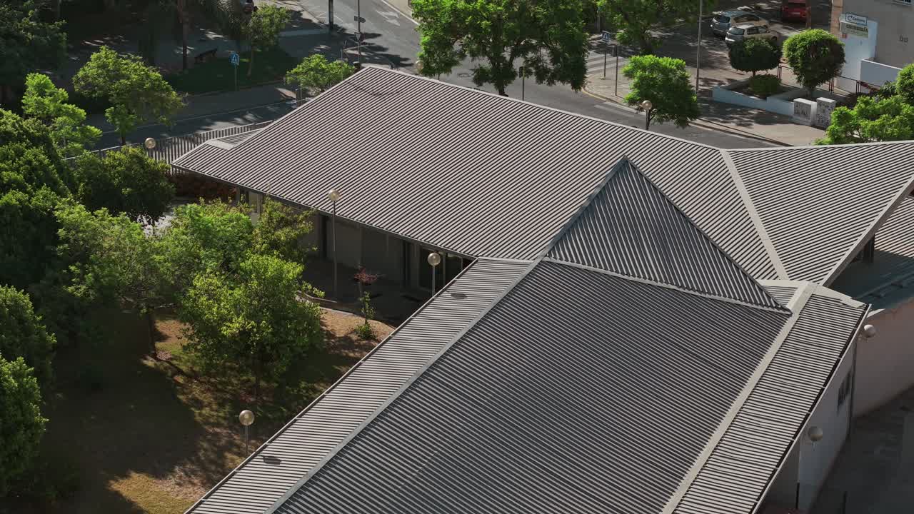 Aerial view of a rooftop showing geometric patterns and textures, creating an interesting architectural landscape