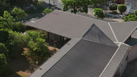 aerial view of a rooftop showing geometric patterns and textures, creating an interesting architectural landscape