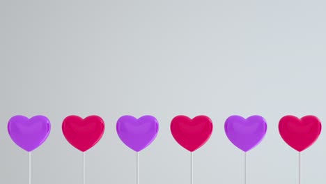 corazones púrpuras rojas en palos blancos en fondo aislado azul. mueverse a la izquierda y girar. copiar espacio. símbolos de amor, como, feliz de las mujeres, madre, valentín, cumpleaños. bucle de animación 3d de 4k