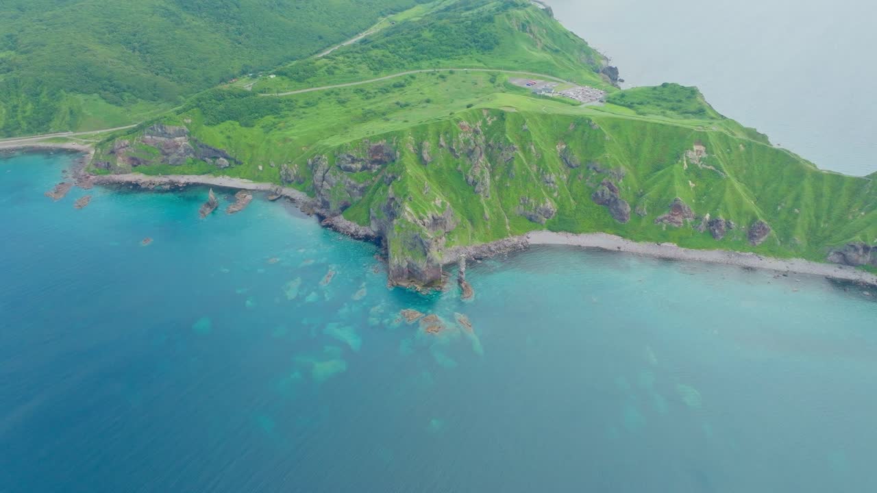 Japanese summer destination in Shakotan Hokkaido, Drone fly above beach, aerial above the clouds
