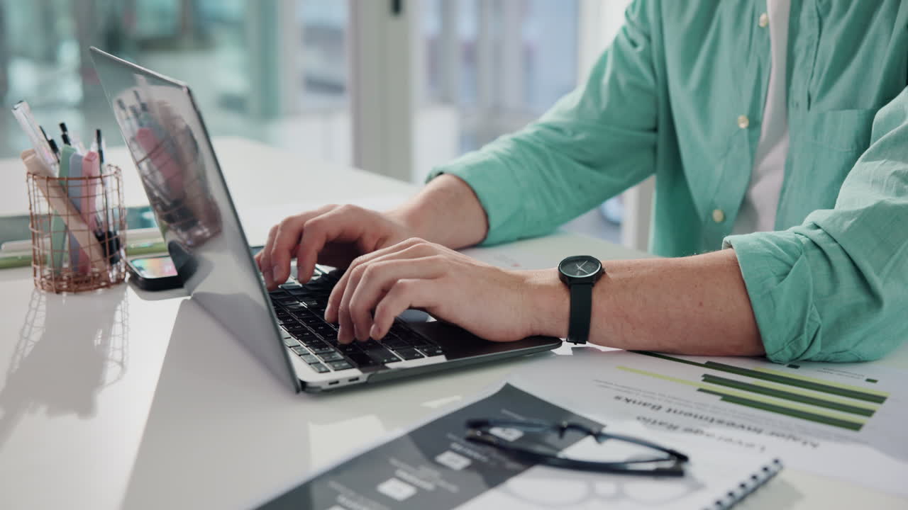 Typing on a Laptop at the Office