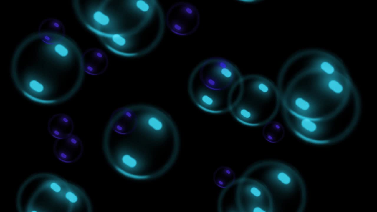 Colorful soap bubbles moving on a black background. Psychedelic background for a disco or nightclub