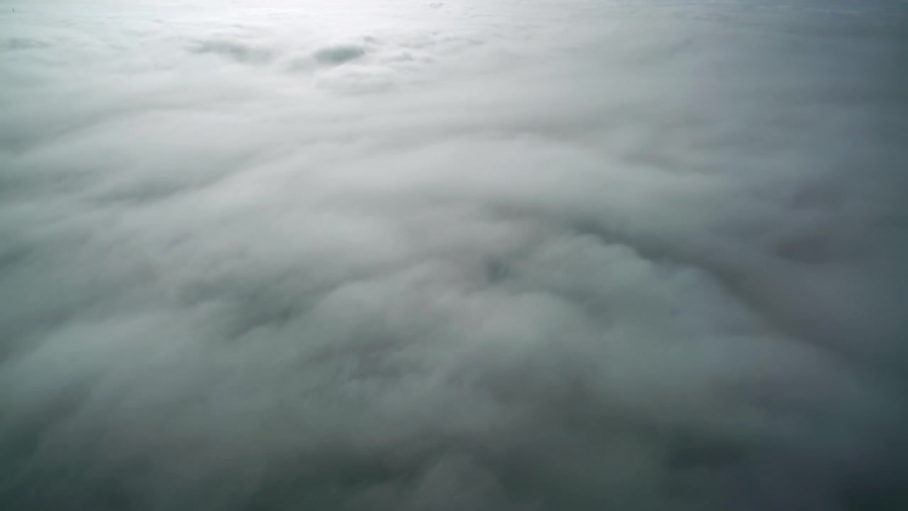 Aerial View of Thick White Clouds Drifting Slowly