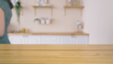 woman-takes-basket-with-homemade-bread-from-table-closeup