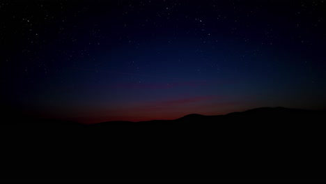 sunset over hills with starry sky