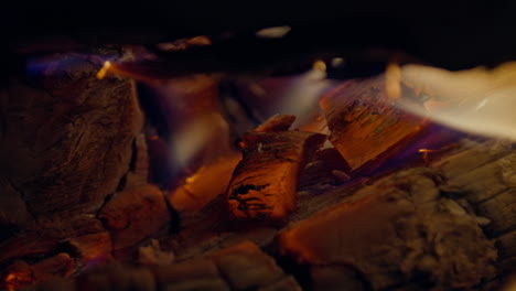 slow motion shot of flames and embers in a fireplace