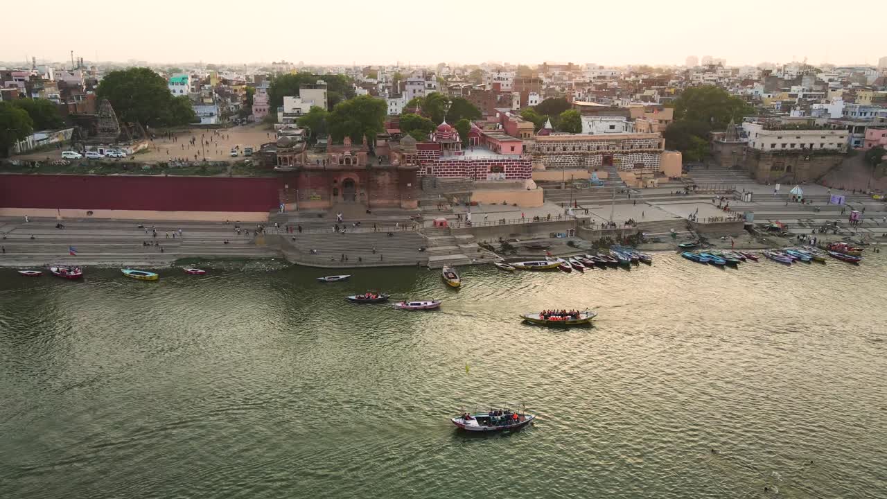 Drone capture of Banaras, featuring the Ganga River and the historic ghats, bathed in soft morning light.