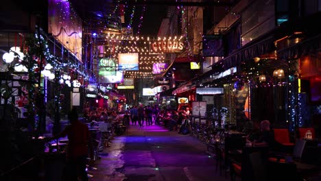 colorful lights and crowds at a lively night market