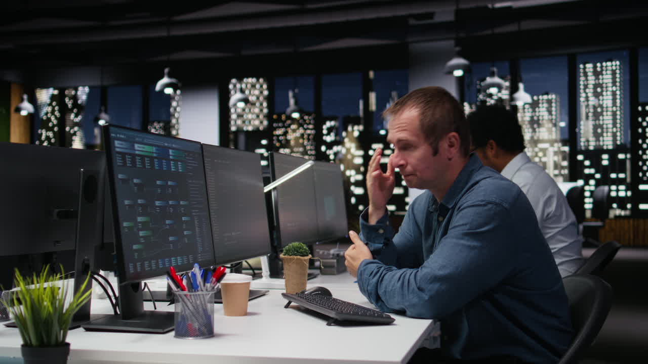 Stressed Programmer Finds Solution Working Late in Modern Office