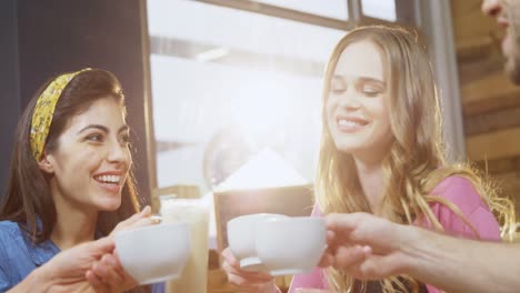 group of friends toasting coffee cups 4k