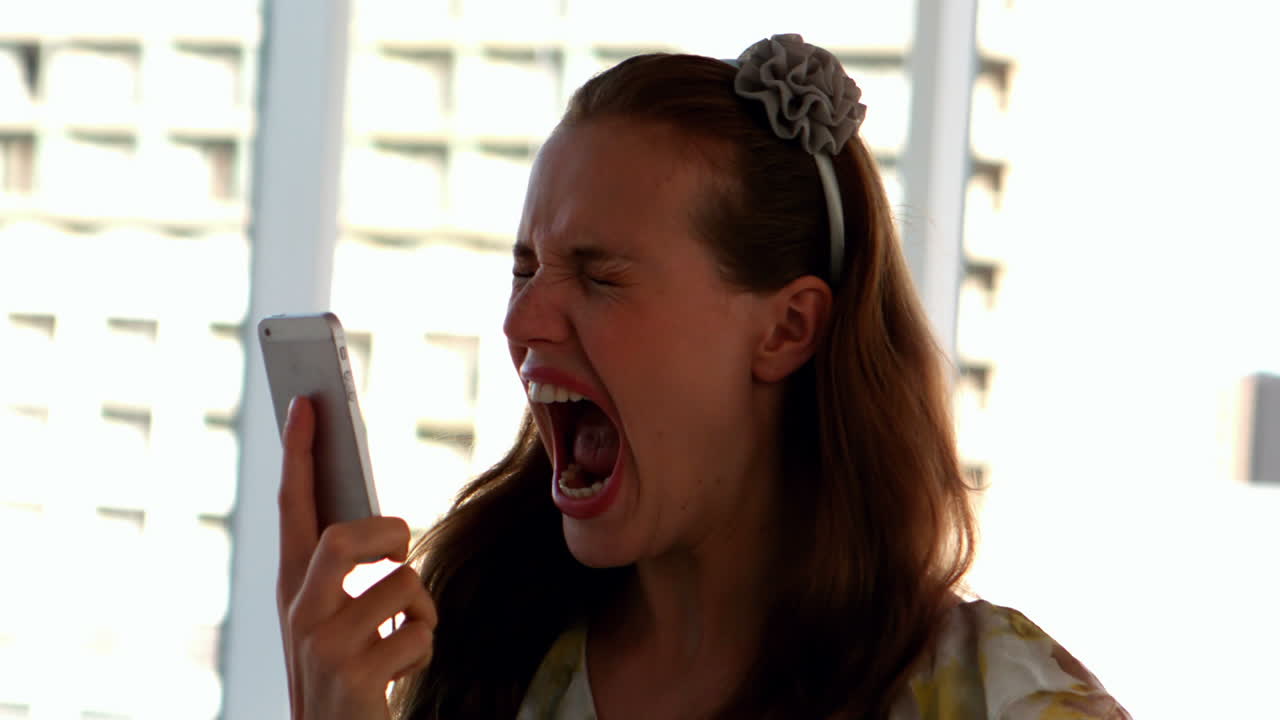 Pretty girl shouting on the phone