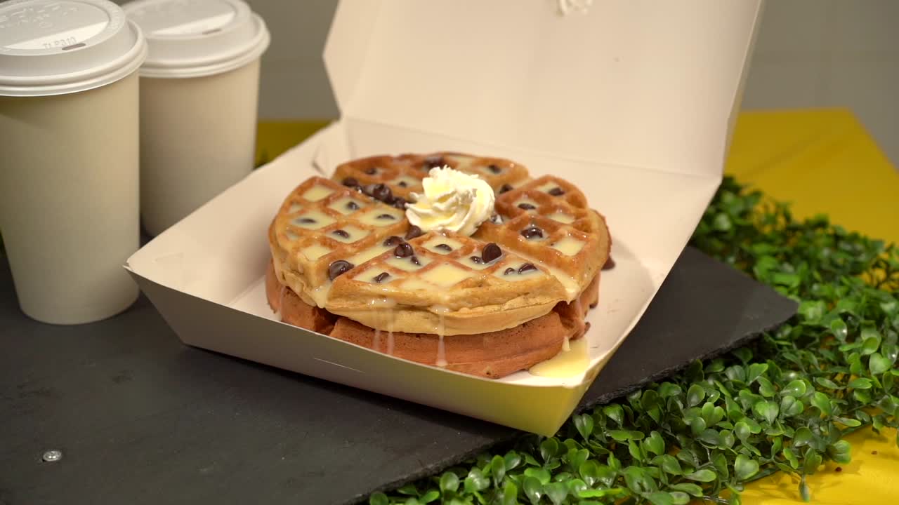 Waffles and coffee take away box slow motion candy sweat cream