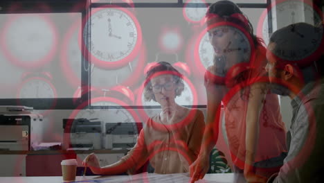 collaborating at office desk, diverse colleagues with clocks animation in background