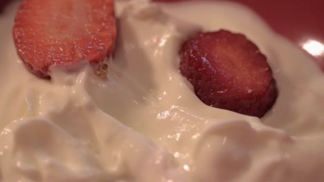 sliced strawberry in creamy yoghurt