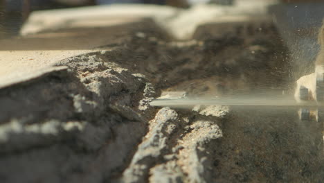 Closeup-of-a-saw-blade-cutting-through-a-tree-trunk-as-it-approaches-camera-in-slow-motion