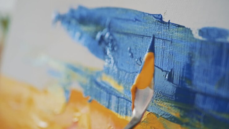 Detail eines Spachtels, der auf einer impressionistischen Leinwand malt 1