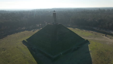 jib up of austerlitz pyramid in the netherlands on a sunny day. the piramide van austerlitz is a monument in the netherlands, built in 1804 as a tribute to napoleon bonaparte.