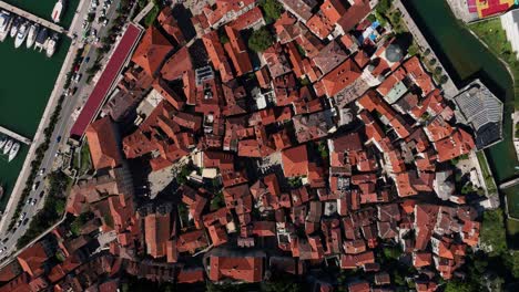top down vertical aerial view of kotor old town city center - dolly in