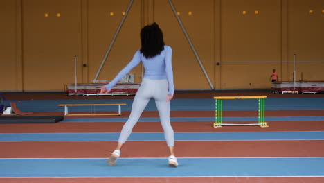 Woman-warming-up-indoors