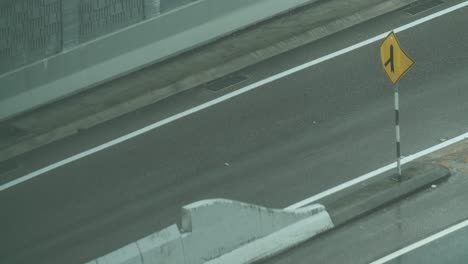 closeup isometric shot of cars on highway speeding timelapse during rainy day