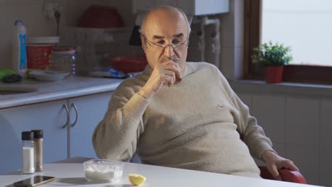 Thoughtful-old-adult-man-sitting-alone-at-home-thinking-about-loneliness.-Don't-get-lost-in-thoughts.