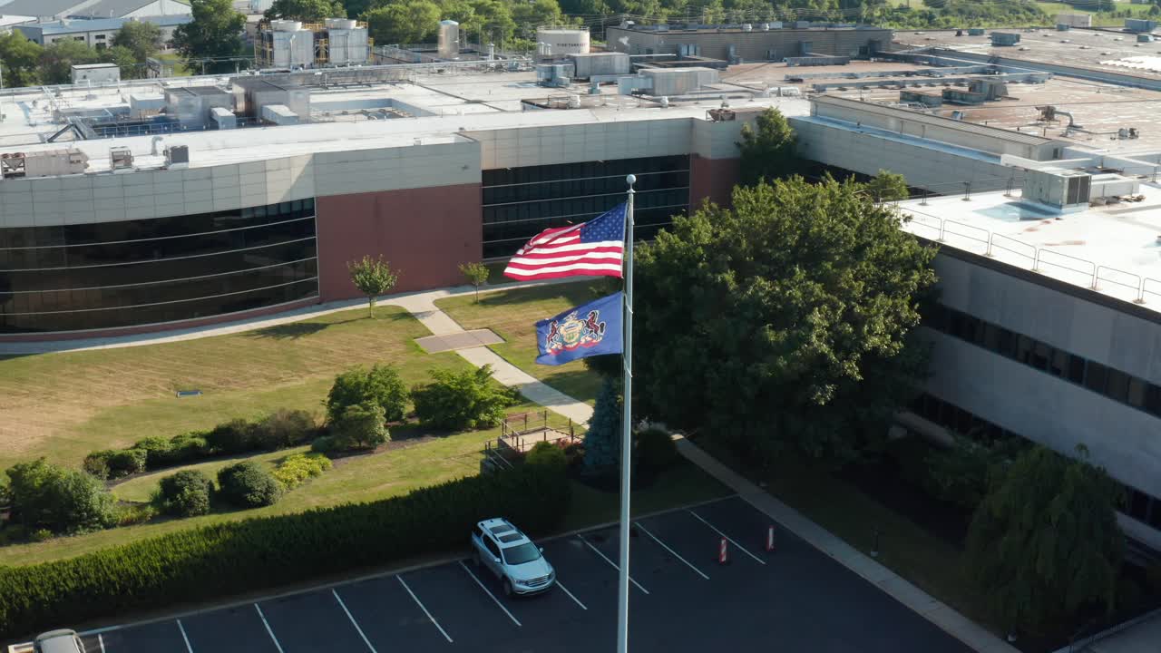 American USA, Pennsylvania flags at corporate office building, manufacturing plant, facility